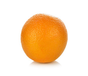 Close-up of orange apple against white background