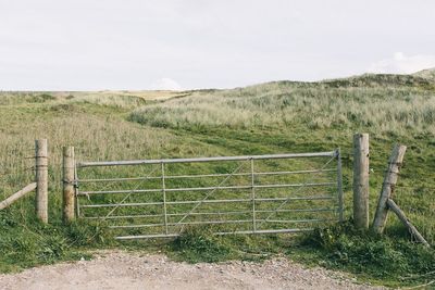 Wooden fence on field