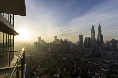 High angle view of city at sunset