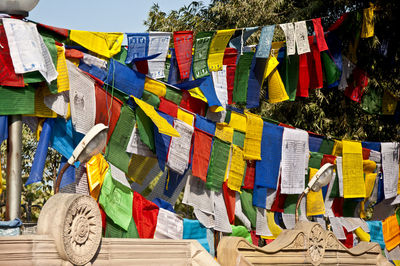 Low angle view of multi colored flags hanging on tree