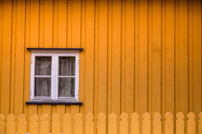 Yellow window of house