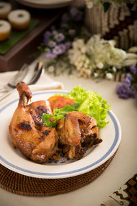 High angle view of fried chicken served on table