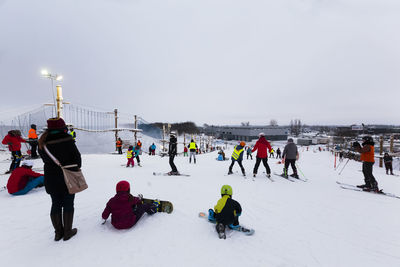 Group of people on snow covered landscape