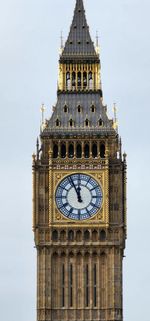 Low angle view of clock tower against sky