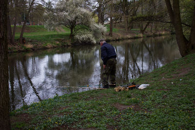 Rear view of a man by the lake