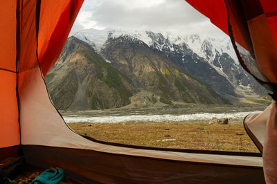 Scenic view of sea by mountains