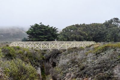 Bridge over river against clear sky