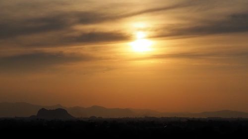 Scenic view of silhouette landscape against romantic sky at sunset