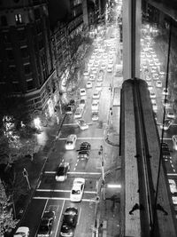 High angle view of city street and buildings at night