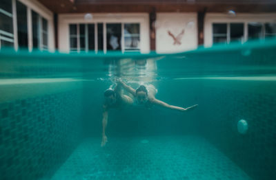 Man swimming in pool