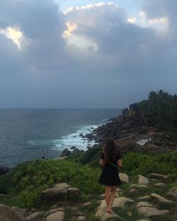 Scenic view of sea against cloudy sky