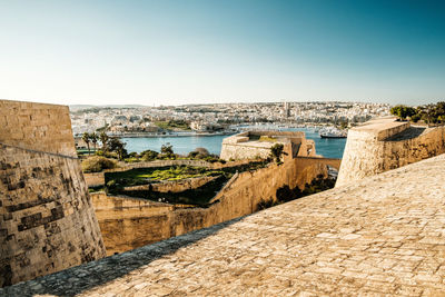 Panoramic view of castle against clear blue sky