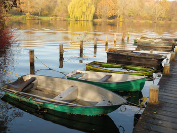 Boats moored in lake