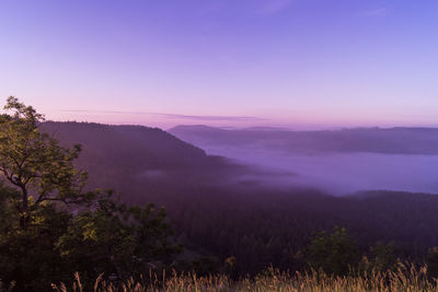 Scenic view of mountains against sky during sunset