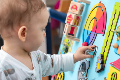 Close-up of cute girl playing with toys