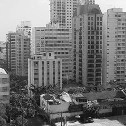 High angle view of buildings in city against sky