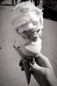 Cropped image of woman holding ice cream