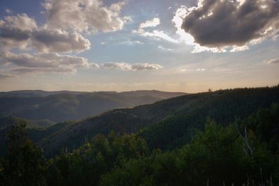 Scenic view of mountains against sky at sunset