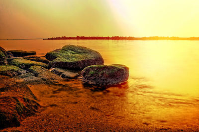 Scenic view of sea against sky during sunset