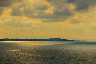 Scenic view of lake against sky during sunset