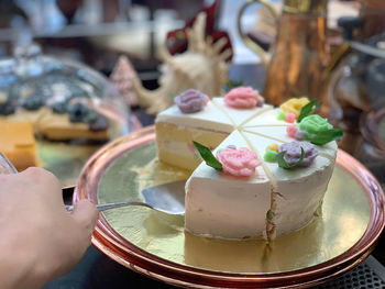 Close-up of hand holding ice cream