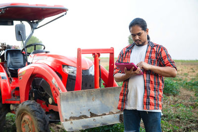 Side view of man working on field