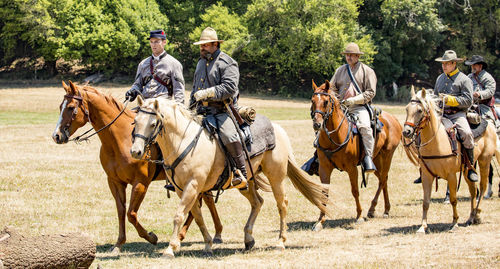 Group of people riding horses