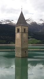 Church amidst lake at south tyrol