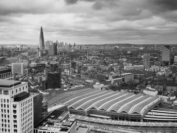 High angle view of buildings in city against sky