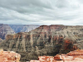 Panoramic view of rocky mountains against sky