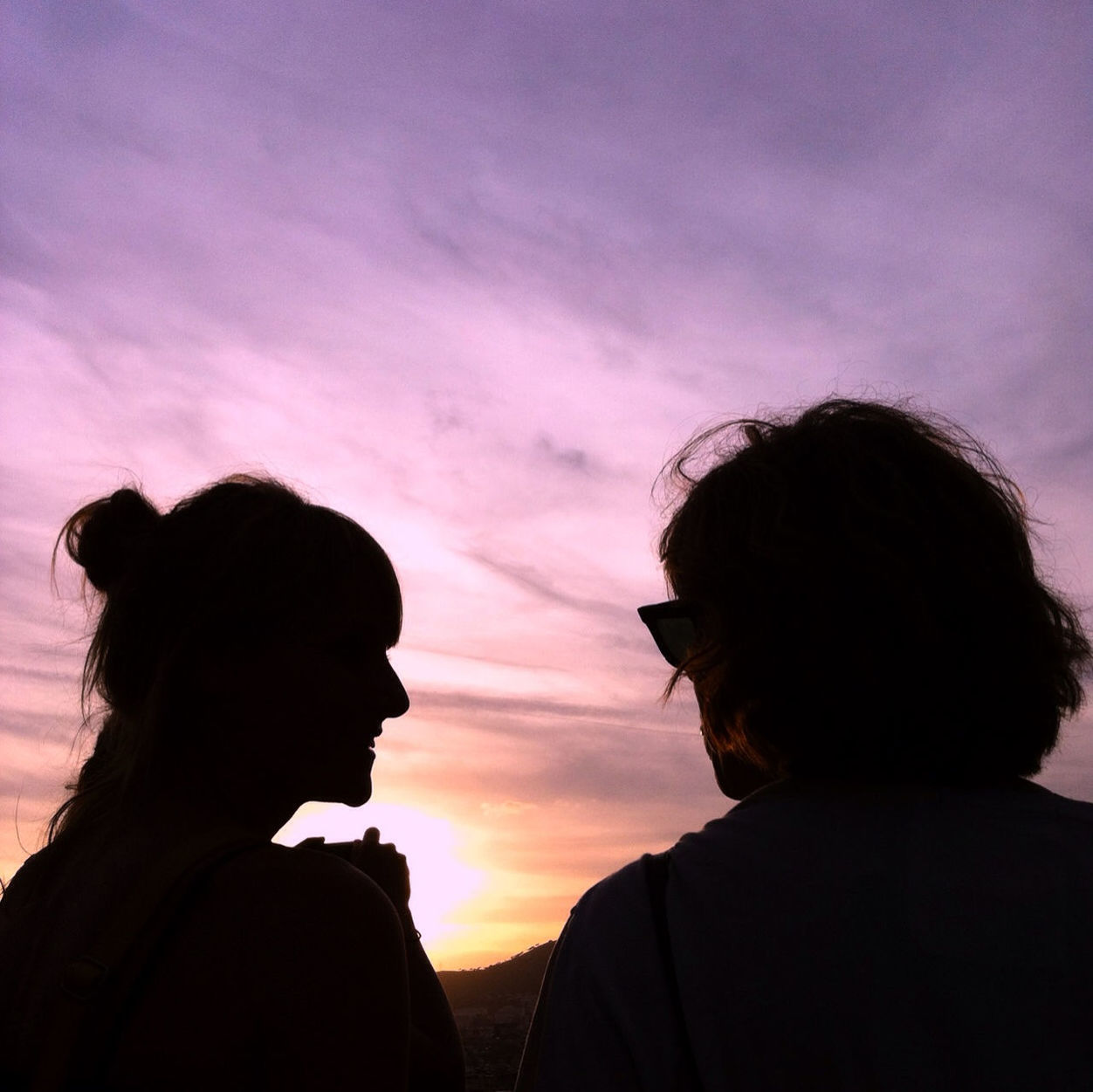 sky, silhouette, sunset, lifestyles, rear view, leisure activity, waist up, cloud - sky, headshot, men, love, togetherness, standing, person, cloud, three quarter length, bonding