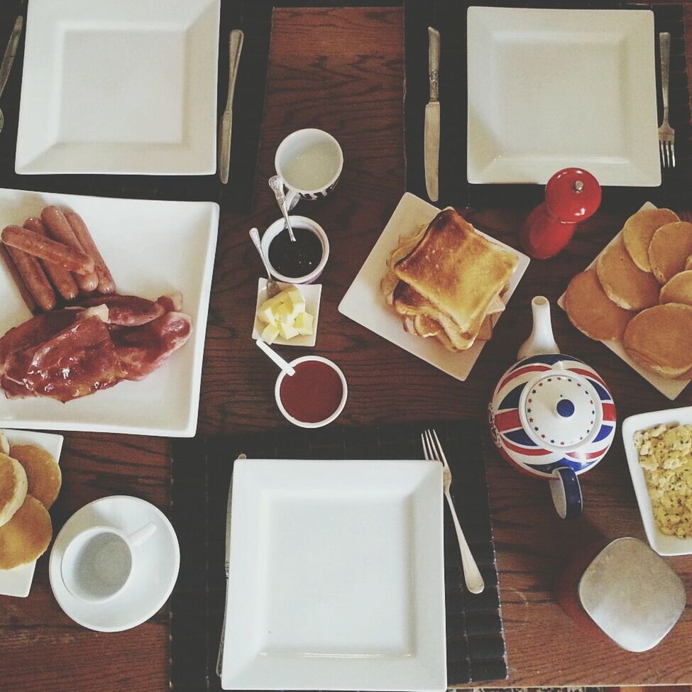 food and drink, indoors, table, freshness, food, plate, still life, drink, ready-to-eat, refreshment, breakfast, coffee cup, high angle view, coffee - drink, indulgence, bread, sweet food, fork, serving size, saucer