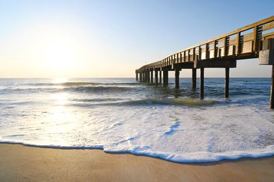 Scenic view of sea against clear sky during sunset