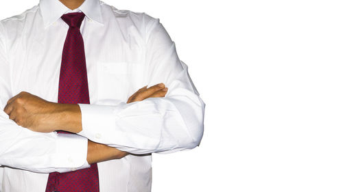 Close-up of man standing against white background