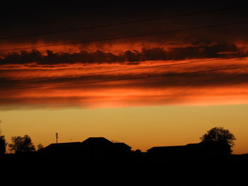 Low angle view of dramatic sky during sunset