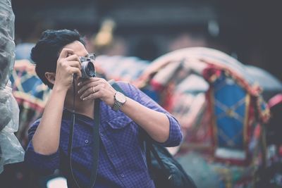 Woman photographing through smart phone