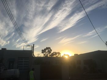 Low angle view of electricity pylon against sky