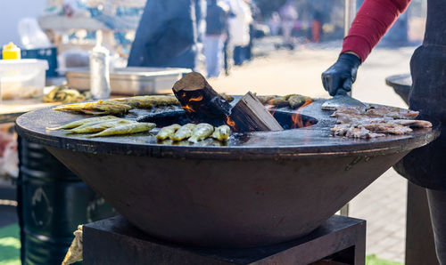Smelt fish is fried on a large grill during the fish festival in svetlogorsk russia
