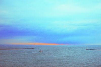 Scenic view of sea against cloudy sky