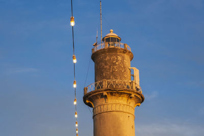 Low angle view of lighthouse against sky
