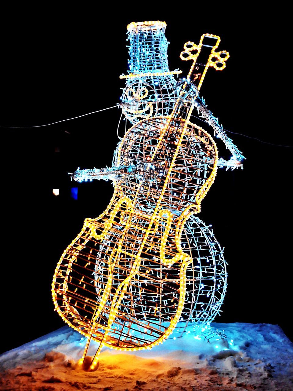 night, illuminated, low angle view, motion, arts culture and entertainment, blue, amusement park ride, long exposure, glowing, clear sky, no people, amusement park, black background, lighting equipment, ferris wheel, tall - high, spinning, close-up, outdoors, studio shot