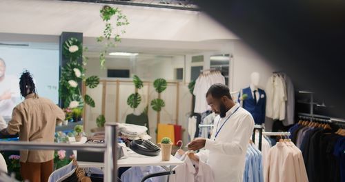 Rear view of doctor examining chemical in laboratory