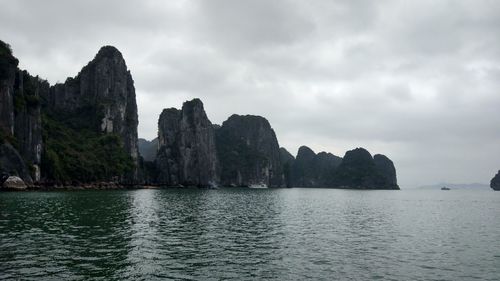 Scenic view of sea and rocks against sky