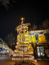 Low angle view of illuminated building at night