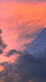 Low angle view of dramatic sky during sunset