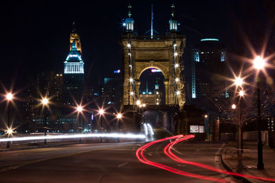 Light trails on illuminated city at night