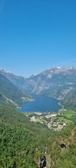 Scenic view of mountains against clear blue sky