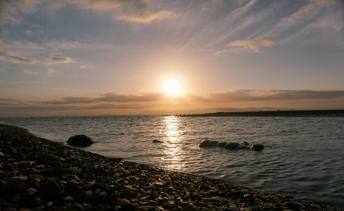 Scenic view of sea against sky during sunset