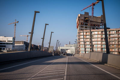 Construction site in city against clear sky