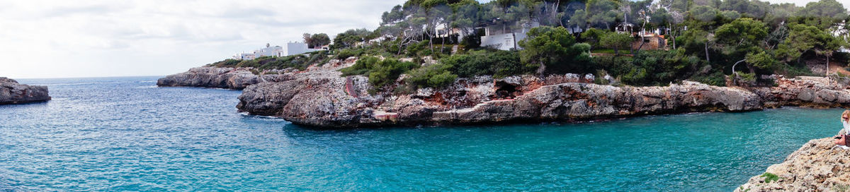 Panoramic view of rocks on beach, cala d'or 